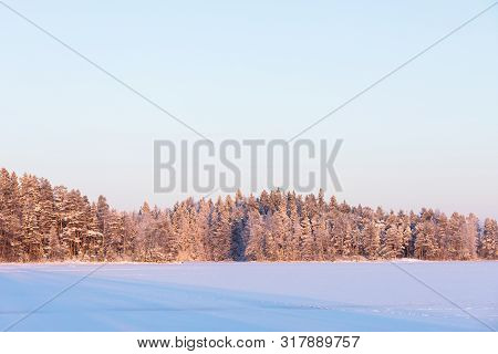 Winter Forest Island At Forzen Lake Sunset Landscape