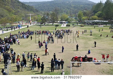 Pyongyang, North Korea - May 1, 2019: Local People And Tourists From Different Countries Celebrate M