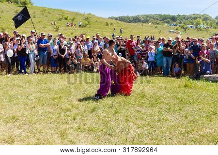 Dnepropetrovsk Region, Ukraine - June 2, 2018: Two Young Cossacks Fighting During The Ethno-rock Fes