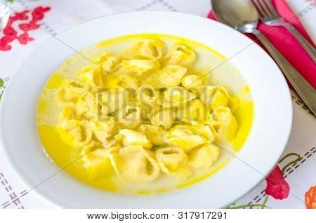 Traditional Italian Homemade Tortellini In Broth Soup. Real Italian Dinner In Countryside. Italian F