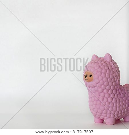 Pink Small Llama Squishy On White Empty Background. Square With Copy Space. Isolate. Soft Toy For Ki