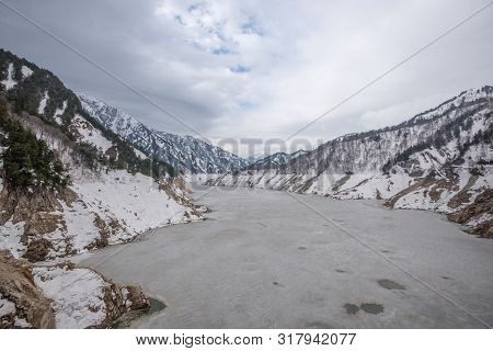 Scene Of Kurobe Dam Between Snow Wall At Tateyama Kurobe Alpine Route, Japan