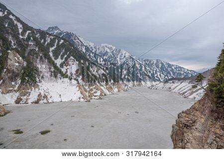 Scene Of Kurobe Dam Between Snow Wall At Tateyama Kurobe Alpine Route, Japan