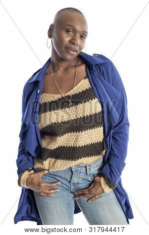 Black African American Fashion Model With Bald Hairstyle Confidently Posing With A Vibrant Blue Colo