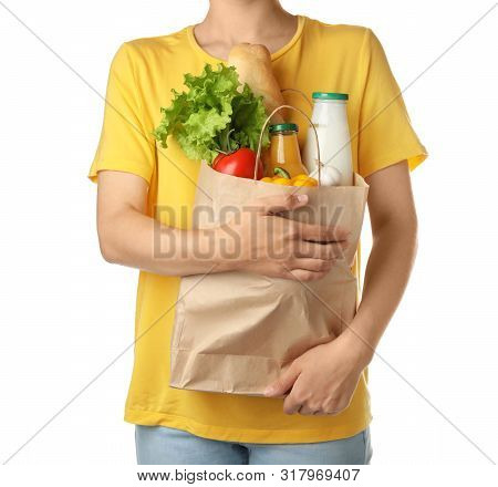 Woman Holding Shopping Paper Bag With Different Groceries On White Background
