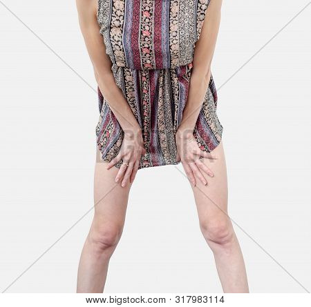 Young Woman In A Dress, Body, Legs, Stands In A Sexy Pose, Spreading Legs Isolated On White Backgrou