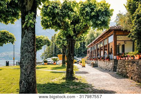 Bellagio, Italy - June 13, 2019: Wooden Terrace Of Restaurant La Punta On Lake Como (italian Lago Di