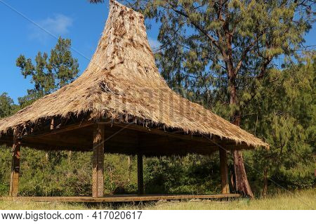 Shelter With A Reed Roof By The Colorful Lakes On The Volcano Kelimutu. Traditional Architecture Of 