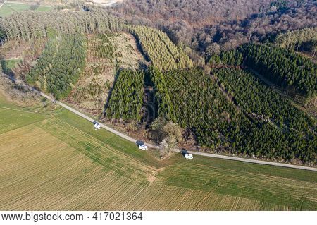 Aerial view on a campsite of camping-car group, in a field, belgian ardennes