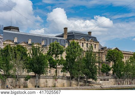 Trees And Haussmann Buildings Along The Bank Of Seine River