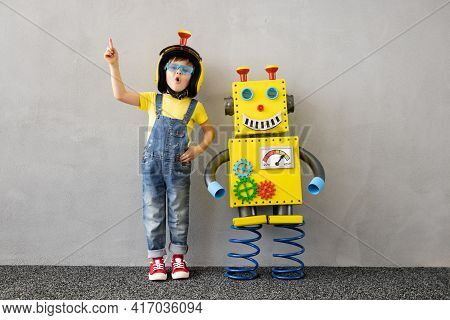Happy Child With Toy Robot