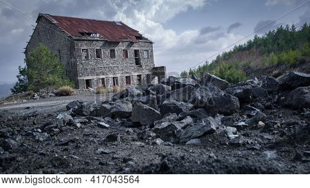 Pile Of Mine Tailings Closeup And Abandoned Building Of Asbestos Mine In Amiantos, Cyprus