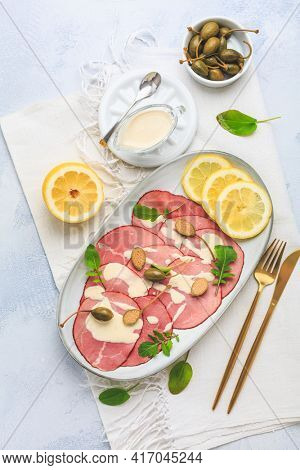 Vitello tonnato - Italian cuisine, sliced veal with tuna sauce as antipasto with capers