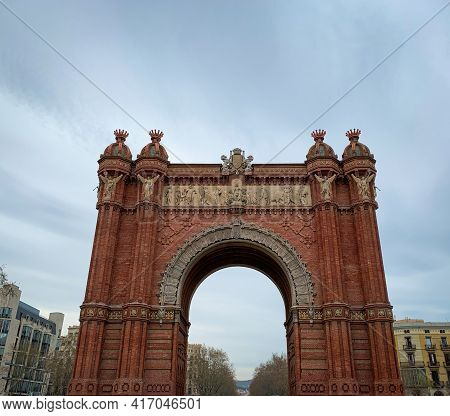 Front View Of The Famous Red Arc De Triomf In Barcelona, Spain.
