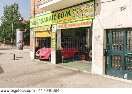 Madrid, Spain - August 7, 2018 - Madrid Chamartín - Taller Barato Car Mechanic