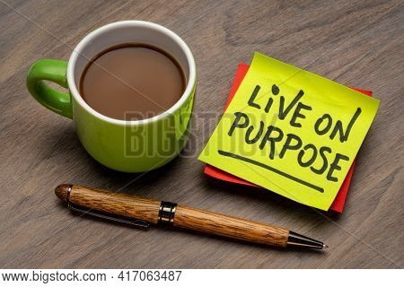 Live on purpose inspirational note - handwriting on a sticky note with a cup of coffee, personal development, goals and lifestyle concept