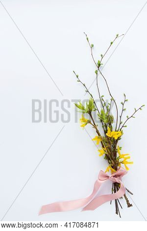 Spring Bouquet Of Twigs With Leaves And Flowers Tied With A Ribbon