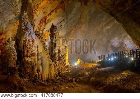 Phong Nha, Vietnam - April 08, 2016: Colorful Paradise Cave With Big Stalagmites And Stalactites In 