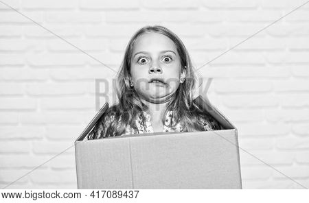 Make Moving Easier. Girl Small Child Carry Cardboard Box. Move Out Concept. Prepare For Moving. Rent