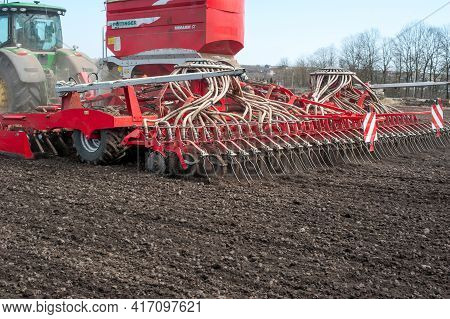 Rear View Of The Seeder With A Tank And Tubes Of Pneumatic Giving At Sowing