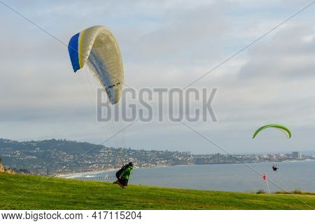 Man Doing Sport, Para-glider In The Clouded Sky. Paragliding Is An Extreme Sport And Recreation. Tor