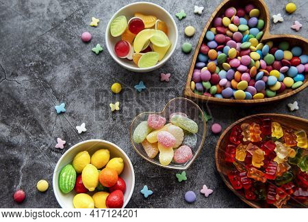 Multicolored Candies, Dragees And Jelly On A Black Background
