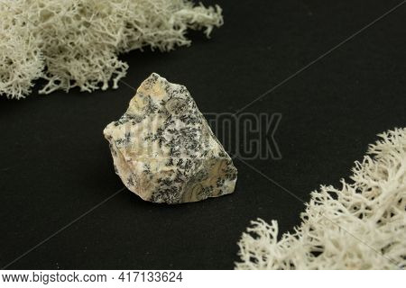 Dendrite Manganese Oxides From Morocco. Natural Mineral Stone On A Black Background Surrounded By Mo
