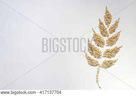 Spikelet From Grains. On A White Background With A Copy Space.