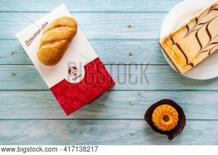 Lodz, Poland, 04.03.2021 Pastry Pastries Of The Polish Bakery Pulka, On A Wooden Background Top View