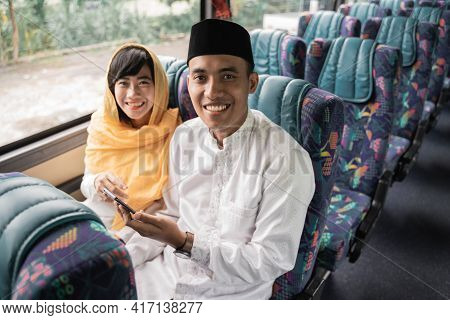 Muslim Couple Travel By Bus During Eid Mubarak Holiday