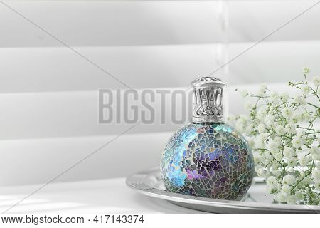 Beautiful Catalytic Purifying Lamp And Flowers On Window Sill, Space For Text. Interior Element
