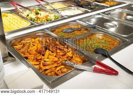 Side Dishes On The Serving Line, Self-service Restaurant. Steamed Vegetables, Rice, Buckwheat, Potat