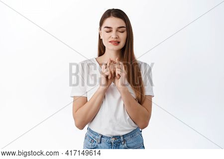 Hopeful Stylish Girl Cross Fingers For Luck, Biting Lip Eager To Receive Positive Result, Anticipati