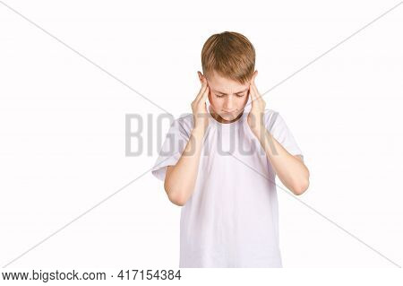 Children Portrait In White T-shirt. Studio Isolated Concept. Headache Problem. Health Care. Bad Face