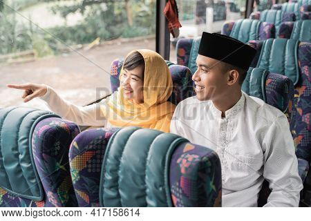 Muslim Couple Travel By Bus During Eid Mubarak Holiday