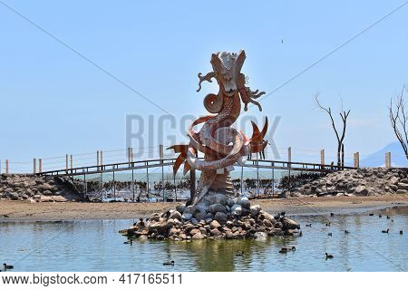 Jocotepec, Mexico - April 4 2021: View Of The Quetzalcoatl Statue On The Jocotepec Boardwalk