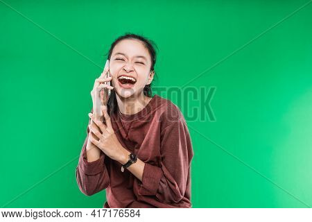 Beautiful Young Asian Woman Is Talking On The Phone With Expression Laugh Happily
