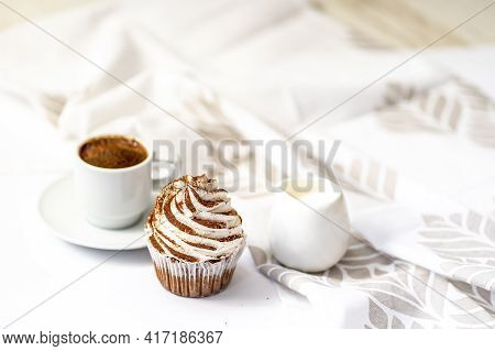 Black Coffee With Cupcakes And Muffins. Spice Cupcakes With Creamcheese Frosting Decorated With A Co