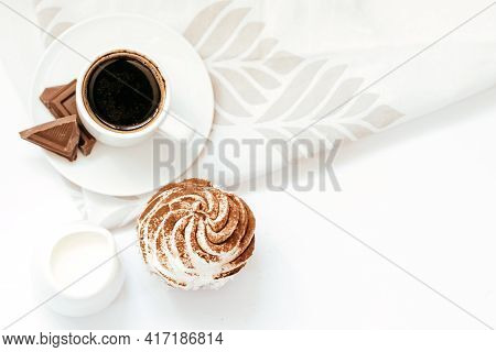 Dark Chocolate And Cocoa Chocolate Cupcakes With A Cup Of Hot Black Coffee. Space For Text