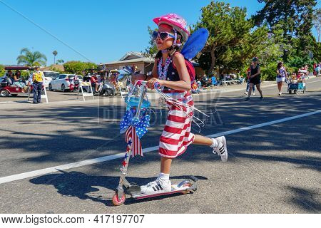 Young Girls With American Flag Parading At The 4th Of July Independence Day Parade In Rancho Bernard