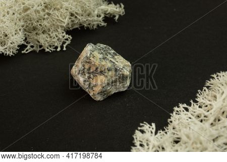 Dendrite Manganese Oxides From Morocco. Natural Mineral Stone On A Black Background Surrounded By Mo