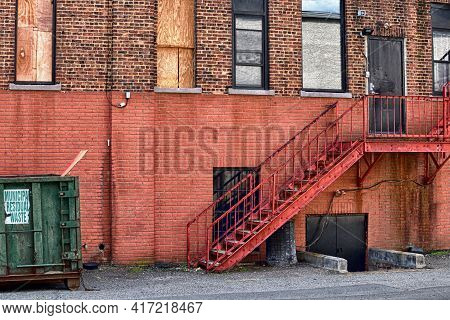 Shot of a side of a side of a building from the ally. Urban environment.