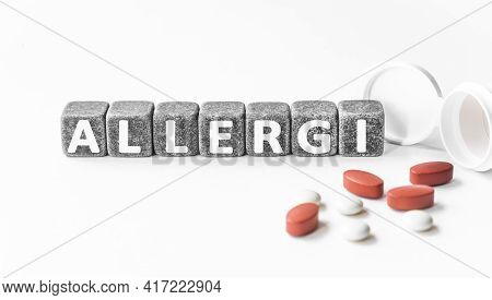 The Word Aesthetician Is Written Near Pills On A Light Blue Background. Medical, Health And Happines