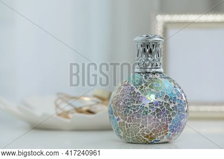 Burning Catalytic Purifying Lamp On Table, Space For Text. Interior Element