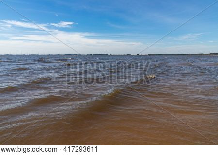 Waves In Lake With Blue Sky
