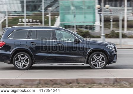 Black Full-size Luxury Suv Mercedes-benz Gl-class X166 Rides In The City Street. Side View Of Fast M