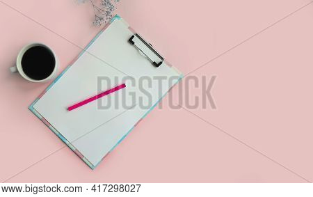 Notebook, Cup Of Coffee, Gypsophila Flower On Colored Background