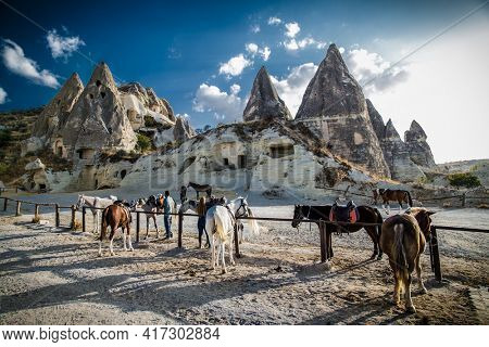 Goreme, Cappadocia- October 22, 2020 : Local people rent horses  for riding and photography in Love Valley in Cappadocia, Goreme, Turkey.