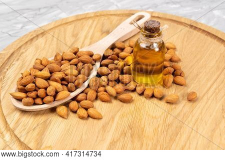 Bottle Of Apricot Seed Oil Prunus Armeniaca Oleum On A Concrete Background
