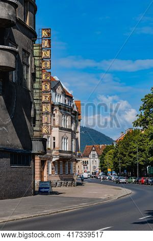 Walbrzych, Poland - June 15 2020: Cityscape Of City Streets And Buildings With Mountains At Backgrou